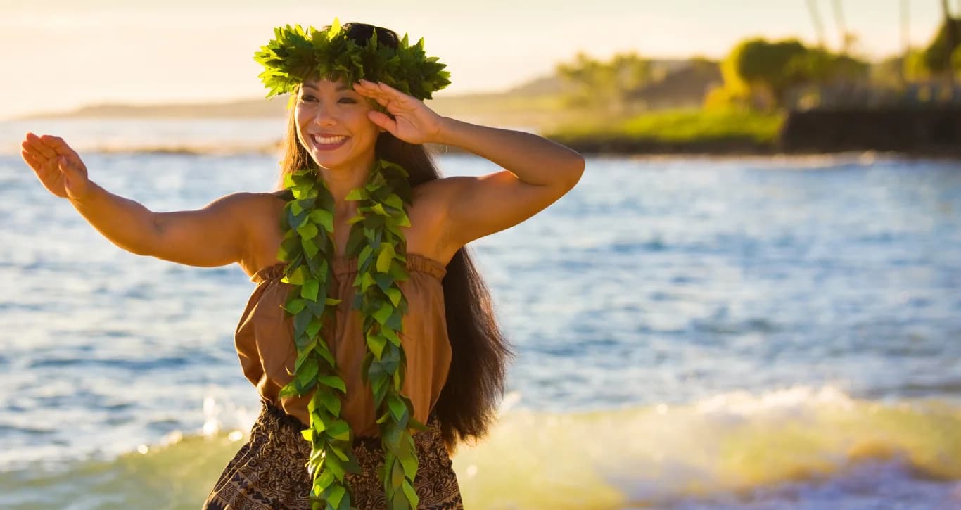Woman in traditional Hawaiian lei looking at the horizon